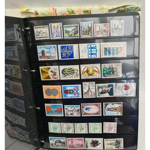 131 - Stamp Album With Canadian Belgium and Other Stamps. Over 100 stamps. Shipping is available. Please a... 