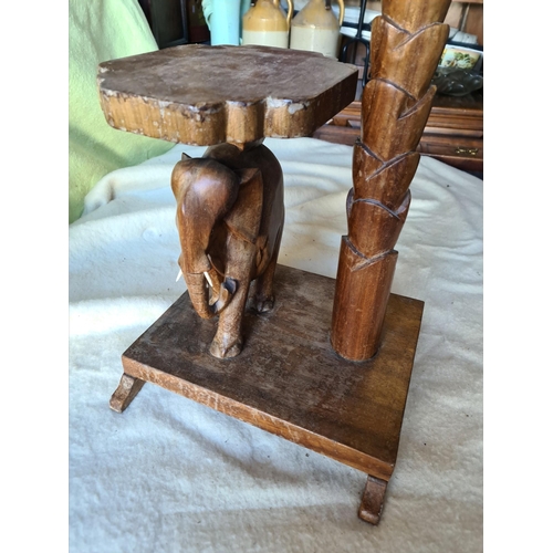 188 - Vintage Hand Carved Hard Wood Elephant Lamp Stand. Measures 12 inches square at the base by 5 feet t... 