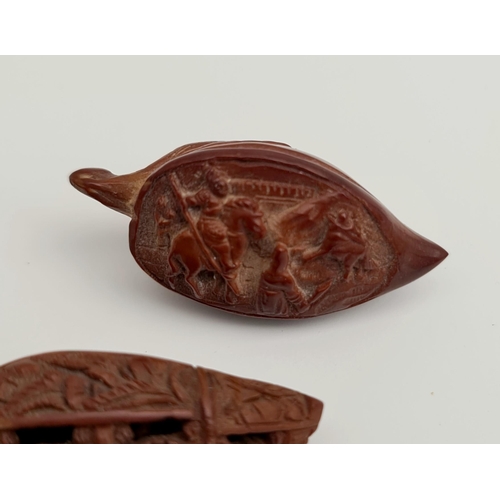 370 - 2 x Oriental Carved Nuts With Miniature Scenes. Includes Possible Hunting or Battle Scene and Boat. ... 