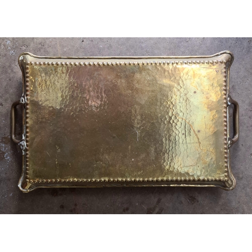 42 - Brass Arts and Crafts Style Tray. Measures 49cm long and 28cm wide.  Shipping is available. Please a... 