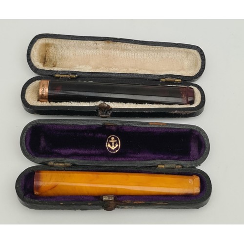 69 - 2 x Cheroot Holders In Original Cases. Includes a 9ct Gold Plated banded cheroot. Each measures 3 in... 