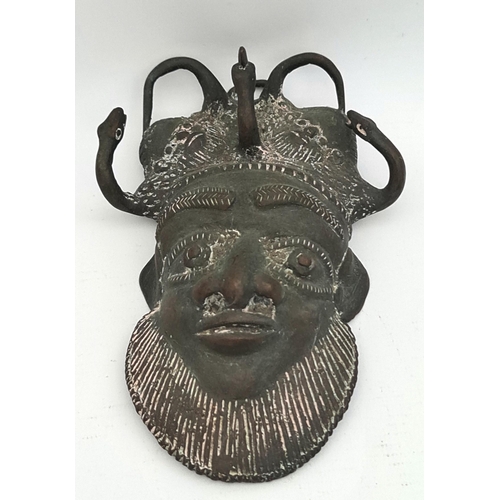 12 - Vintage Bronze Cast African Tribal Mask. Measures 6 inches long by 4 inches wide. The head dress is ... 