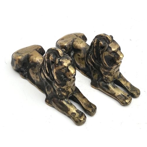 146 - Two early 20 century Bronze Rough Cast Lion Figures. Each Measure 18cm long by 9cm tall. Shipping is... 