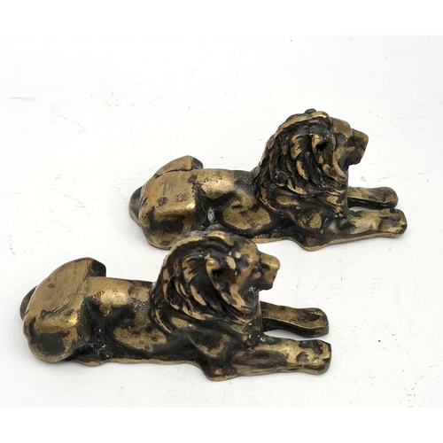 146 - Two early 20 century Bronze Rough Cast Lion Figures. Each Measure 18cm long by 9cm tall. Shipping is... 