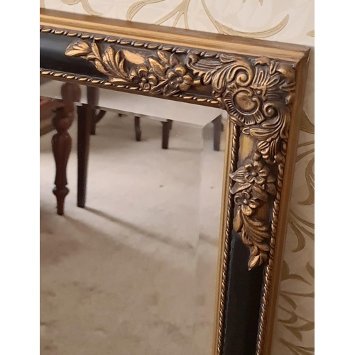 182 - Vintage French Style Bevelled Wall Mirror. Black wooden frame with gold coloured flower and leaf mou... 