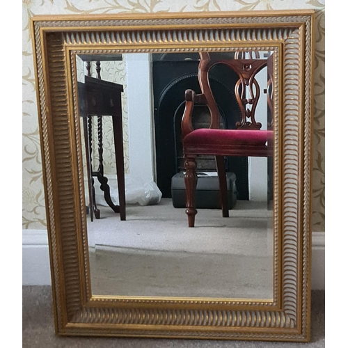 185 - Vintage Wooden Framed Gilt Coloured Bevelled Mirror. Measures 24 inches by 33 inches. Shipping is av... 