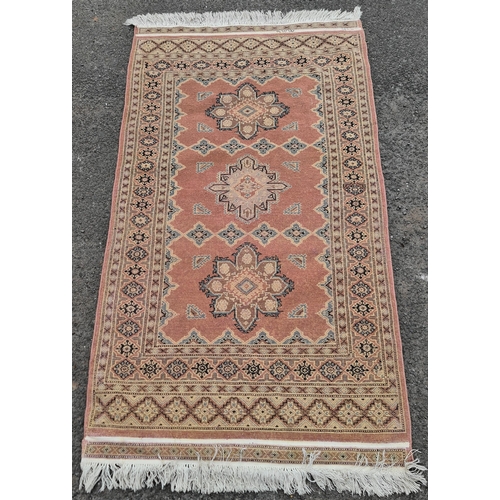 208 - Vintage Salmon Coloured Rug or Runner. Measures 70 inches by 38 inches. Shipping is available. Pleas... 