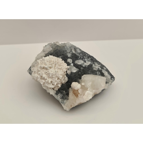 418 - Collectable Mineral Apophyllite and Scolecite Zeolite  Weight 119g. Measures 7cm by 6cm by 4cm thick... 