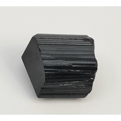 427 - Collectable Mineral Schorl Tourmaline. Measures 3.5cm by 3cm. Total weight 56g. Shipping is availabl... 