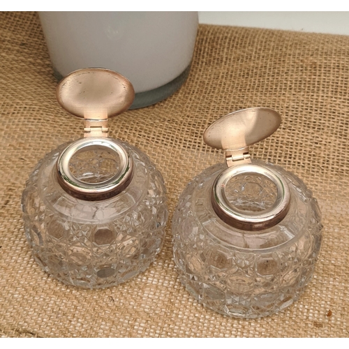 172 - Antique Pair of Cut Glass Inkwell Bottles. Measures 7.5cm diameter by 7cm tall. Shipping is availabl... 