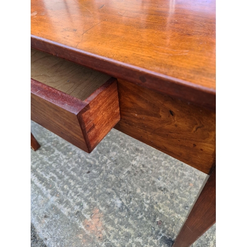 216 - Antique Mahogany Table With Single Drawer. Measures 92cm by 51cm by 72cm tall. Shipping is available... 