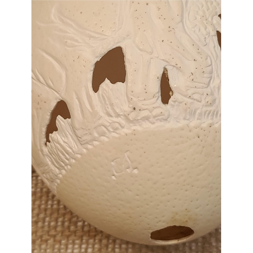 29 - Vintage Hand Carved and Signed Ostrich Egg. Carved with elephants and leaves. Measures 16cm long. No... 