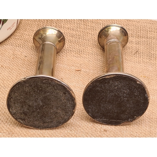 313 - Two Sterling Silver Candlesticks One Hallmarked Birmingham 1922. Makers Marks Rubbed. Each measures ... 