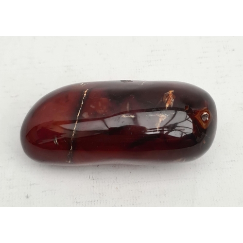 396 - Collectable Mineral Polished Carnelian. Weight 223g. Measures 9cm long 5cm wide and 3.5cm thick. Shi... 