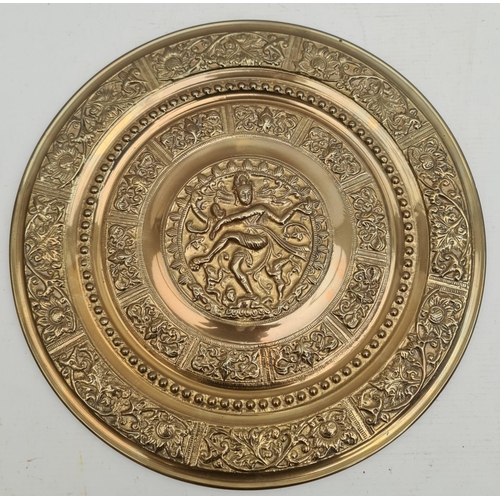 443 - Vintage Round Brass Wall Plaque With Religious deity Embossed in the central panel surrounded by var... 