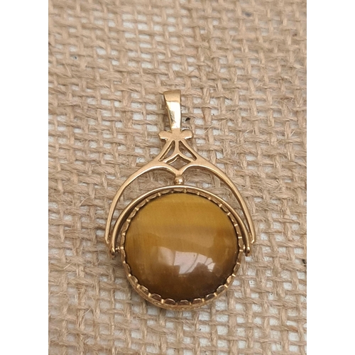 69 - 9ct Gold Swivel Pendant Total Weight 12g. Hallmarked Sheffield 1997 SJ Shipping is available. Please... 