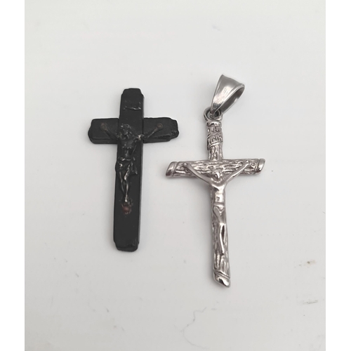 77 - Vintage Crucifix 1 x Wood 1 x silver Coloured Metal. Largest Measures 42mm Long. Shipping is availab... 