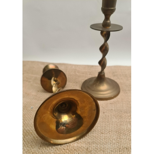 175 - Pair of Vintage Twisted Stem Brass Candlesticks. Each measures 20cm tall. Shipping is available. Ple... 