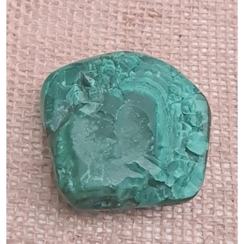 403 - Collectable Rocks and Minerals Malachite. Measures 5cm by 3cm by 2cm weight 64g. Shipping is availab... 