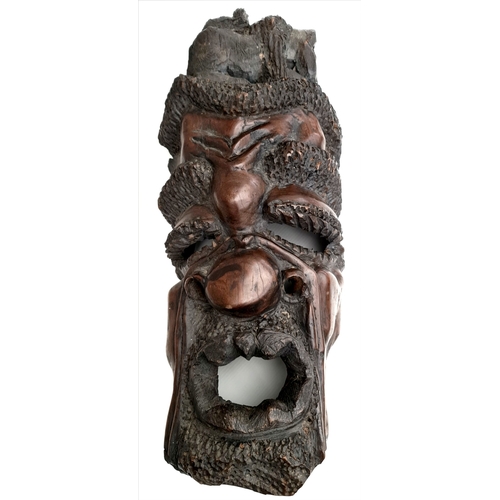 22 - Antiques African Sculptured Agaba Grotesque Face Mask 23 inches Tall. With carved baboon or other mo... 