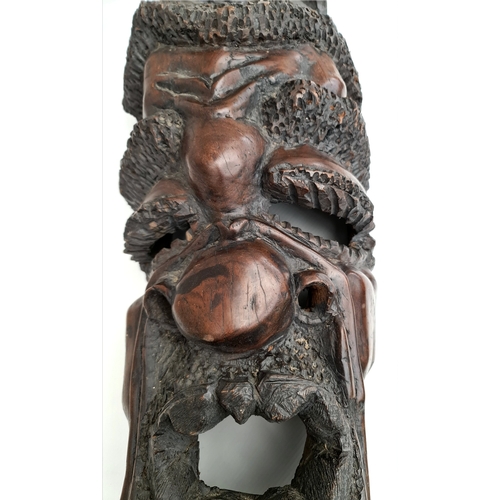 22 - Antiques African Sculptured Agaba Grotesque Face Mask 23 inches Tall. With carved baboon or other mo... 