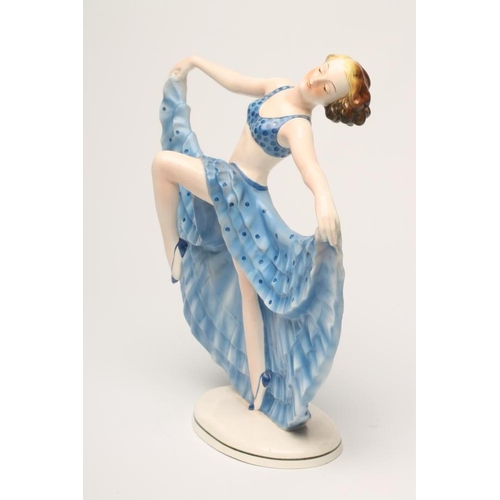 101 - AN ART DECO KATZHUTTE EARTHENWARE OF A YOUNG DANCER wearing a blue spotted bikini top, her arms outs... 