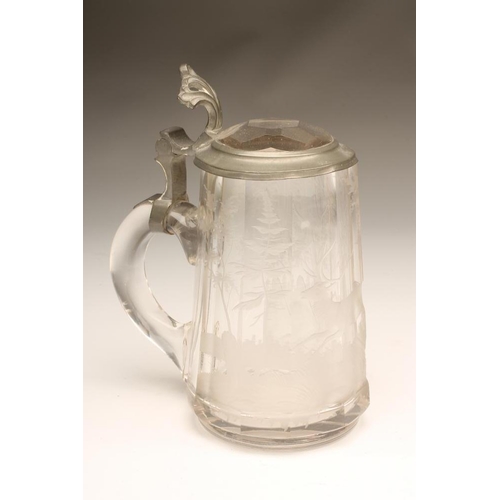 105 - A CLEAR GLASS STEIN, late 19th century, of tapering panelled form engraved with a running stag, with... 