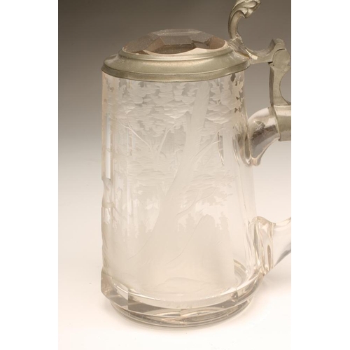 105 - A CLEAR GLASS STEIN, late 19th century, of tapering panelled form engraved with a running stag, with... 