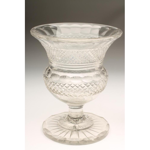 110 - A GLASS CAMPANA URN with diamond and strawberry cut bands raised upon a hexagonal low stem and squar... 