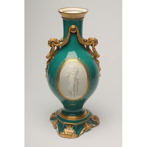 42 - A FRENCH PORCELAIN GARNITURE VASE, mid 19th century, of baluster form, the two scroll handles tied b... 