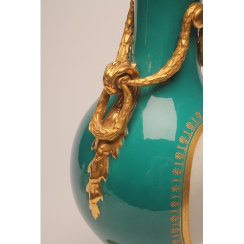 42 - A FRENCH PORCELAIN GARNITURE VASE, mid 19th century, of baluster form, the two scroll handles tied b... 