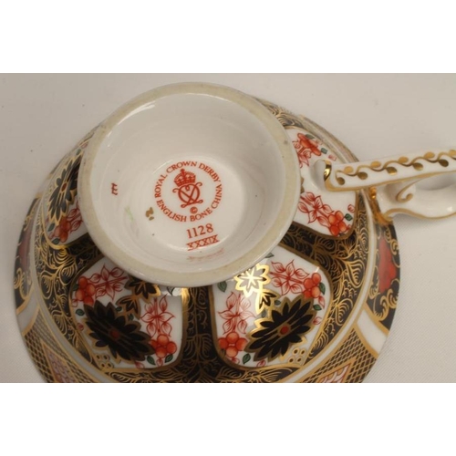 54 - A ROYAL CROWN DERBY CHINA TEA SERVICE, modern, painted with Imari pattern No.1128 and comprising tap... 