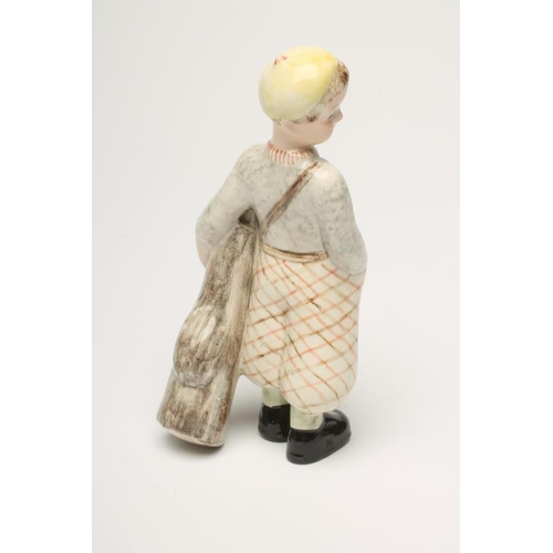 95 - A GOLDSCHEIDER EARTHENWARE FIGURE, 1930's, of a young boy golfer, wearing a yellow beret, grey marl ... 