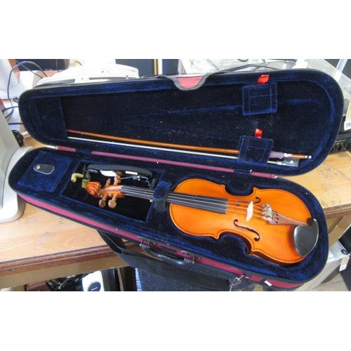 398 - QUARTER SIZE VIOLIN IN RED CASE