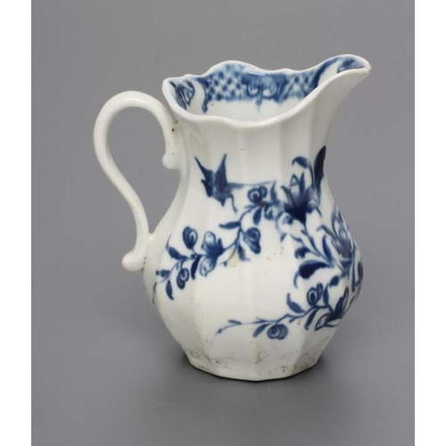 34 - A FIRST PERIOD WORCESTER PORCELAIN MILK JUG, c.1760, of faceted baluster form painted in underglaze ... 