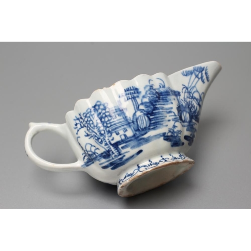 37 - A BOW PORCELAIN BUTTERBOAT, c.1765, of ribbed oval form painted in underglaze blue with the 