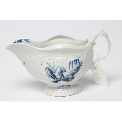 40 - A FIRST PERIOD WORCESTER PORCELAIN SAUCEBOAT, c.1765, of lobed oval form with scroll moulded panels ... 