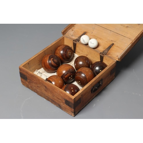 461 - A SET OF EIGHT LIGNUM VITAE LAWN BOWLING BALLS together with a pair of Jacks, the latter inscribed 