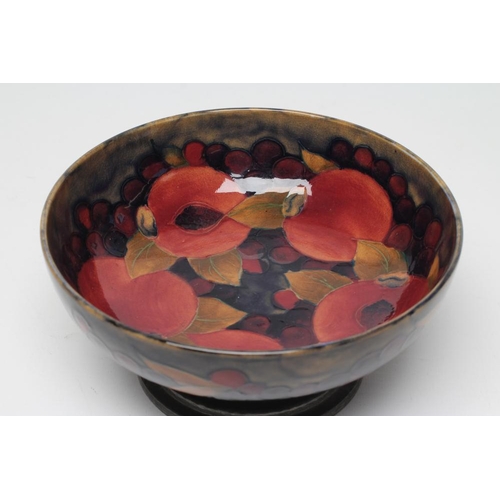 51 - A MOORCROFT POTTERY BOWL, early 20th century, of shallow plain circular form, tubelined and painted ... 