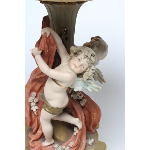 57 - A TURN OF VIENNA BISQUE PORCELAIN FIGURAL TABLE CENTREPIECE, early 20th century, modelled as two put... 