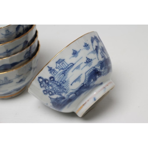 6 - A SET OF SIX CHINESE PORCELAIN RIBBED TEABOWLS AND SAUCERS painted in underglaze blue with a landsca... 