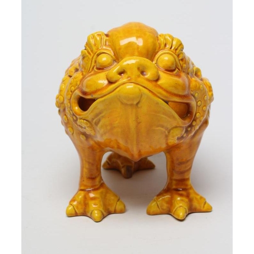 64 - A LARGE BURMANTOFTS POTTERY TOAD SPOON WARMER, standing on three legs in an ochre glaze, impressed a... 