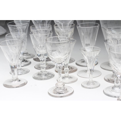 75 - A COLLECTION OF THIRTY ONE GEORGIAN AND LATER WINE GLASSES, mainly with panel cut bowls (Est. plus 2... 