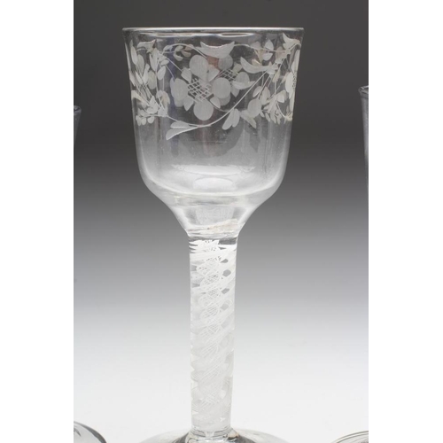 81 - A WINE GLASS, mid 18th century, the plain bowl cut and etched with a band of foliage on a double ser... 