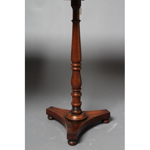 747 - A GEORGIAN MAHOGANY TRIPOD TABLE, early 19th century, the rounded oblong snap top raised on ring and... 