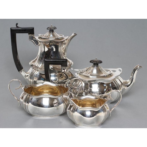 107 - A FOUR PIECE TEA AND COFFEE SERVICE, maker T. Bishton, Birmingham 1918, of lobed oblong baluster for... 