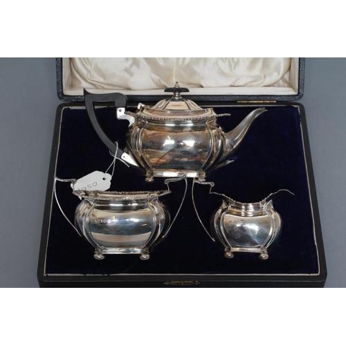 110 - A BACHELOR'S COMPOSITE EDWARDIAN THREE PIECE TEA SERVICE, maker's mark J.R., Sheffield 1904 (teapot)... 