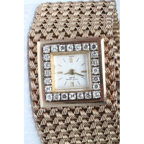 157 - A LADY'S 9CT GOLD AND DIAMOND JAQUET-GIRARD COCKTAIL WATCH, the square silvered dial with applied gi... 
