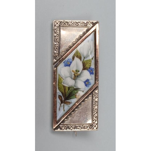 160 - A VICTORIAN BROOCH, the oblong panel with engraved geometric border enclosing an applied lozenge pan... 