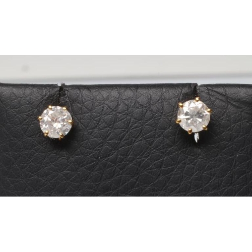 166 - A PAIR OF SOLITAIRE DIAMOND EAR STUDS, the round brilliant cut stones totalling approximately 1.05ct... 